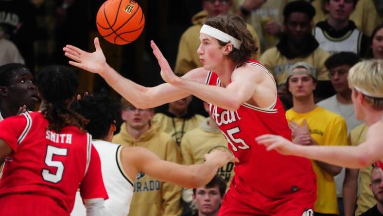 Feb 24, 2024; Boulder, Colorado, USA; Utah Utes center Branden Carlson (35) reaches for a loose ball in the first half against the Colorado Buffaloes at the CU Events Center. Mandatory Credit: Ron Chenoy-USA TODAY Sports