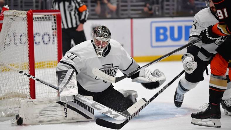 Feb 24, 2024; Los Angeles, California, USA;  Los Angeles Kings goaltender David Rittich (31) defends the goal against Anaheim Ducks center Leo Carlsson (91) during the first period at Crypto.com Arena. Mandatory Credit: Gary A. Vasquez-USA TODAY Sports