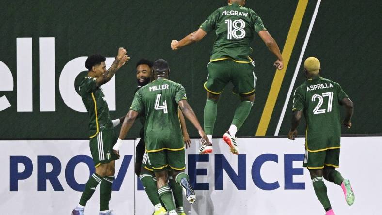 Feb 24, 2024; Portland, Oregon, USA; Portland Timbers forward Antony (11) celebrates with his teammates after scoring a goal against the Colorado Rapids at Providence Park. Mandatory Credit: Troy Wayrynen-USA TODAY Sports