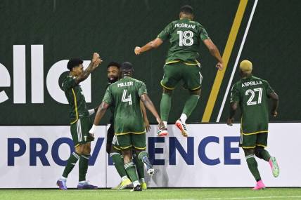 Feb 24, 2024; Portland, Oregon, USA; Portland Timbers forward Antony (11) celebrates with his teammates after scoring a goal against the Colorado Rapids at Providence Park. Mandatory Credit: Troy Wayrynen-USA TODAY Sports