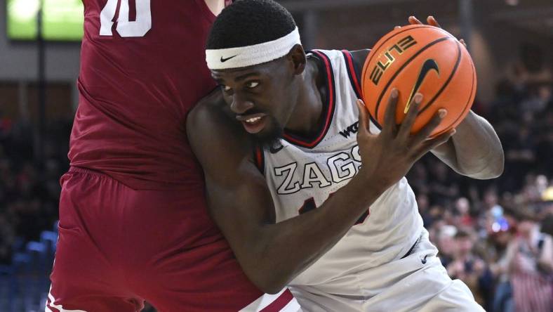 Feb 24, 2024; Spokane, Washington, USA; Gonzaga Bulldogs forward Graham Ike (13) fights for position against Santa Clara Broncos center Francisco Caffaro (10) in the second half at McCarthey Athletic Center. Gonzaga Bulldogs won 94-81. Mandatory Credit: James Snook-USA TODAY Sports