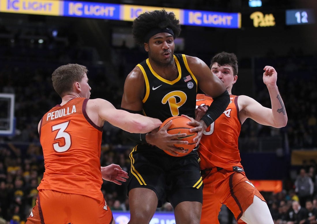 Pittsburgh Panthers Blake Hinson (2) gets fouled by Virginia Tech Hokies Sean Pedulla (3) while going for a layup during the first half on February 24, 2024 at the Petersen Events Center in Pittsburgh, PA.