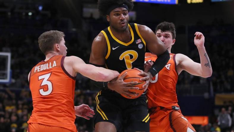 Pittsburgh Panthers Blake Hinson (2) gets fouled by Virginia Tech Hokies Sean Pedulla (3) while going for a layup during the first half on February 24, 2024 at the Petersen Events Center in Pittsburgh, PA.