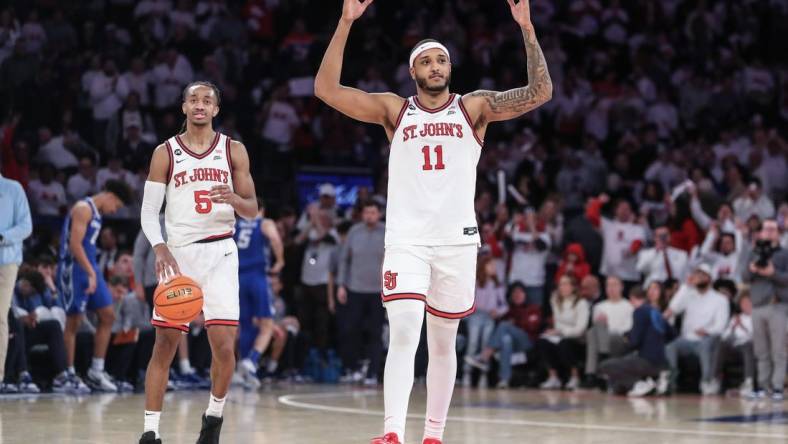 Feb 25, 2024; New York, New York, USA;  St. John's Red Storm center Joel Soriano (11) celebrates in the second half as guard Daniss Jenkins (5) runs out the clock against the Creighton Bluejays at Madison Square Garden. Mandatory Credit: Wendell Cruz-USA TODAY Sports