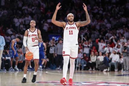 Feb 25, 2024; New York, New York, USA;  St. John's Red Storm center Joel Soriano (11) celebrates in the second half as guard Daniss Jenkins (5) runs out the clock against the Creighton Bluejays at Madison Square Garden. Mandatory Credit: Wendell Cruz-USA TODAY Sports