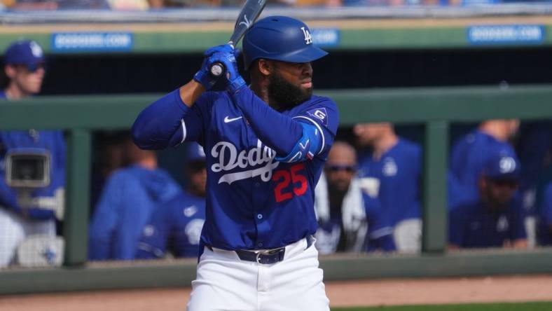 Feb 25, 2024; Phoenix, Arizona, USA; Los Angeles Dodgers designated hitter Manuel Margot (25) bats against the Oakland Athletics during the third inning at Camelback Ranch-Glendale. Mandatory Credit: Joe Camporeale-USA TODAY Sports