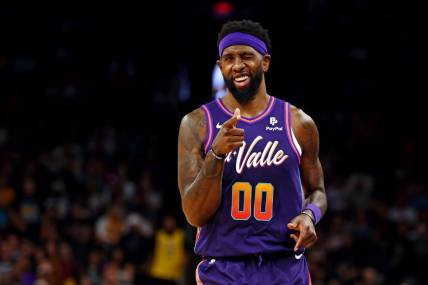 Feb 25, 2024; Phoenix, Arizona, USA; Phoenix Suns forward Royce O'Neale (00) reacts after a play during the second quarter of the game against the Los Angeles Lakers at Footprint Center. Mandatory Credit: Mark J. Rebilas-USA TODAY Sports