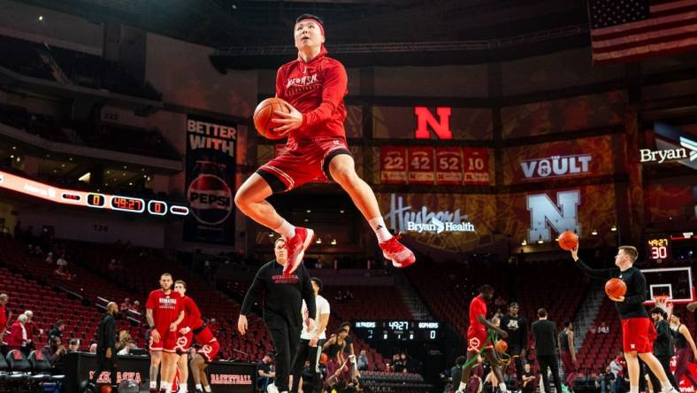 Feb 25, 2024; Lincoln, Nebraska, USA; Nebraska Cornhuskers guard Keisei Tominaga (30) jumps during warmups before the game against the Minnesota Golden Gophers at Pinnacle Bank Arena. Mandatory Credit: Dylan Widger-USA TODAY Sports