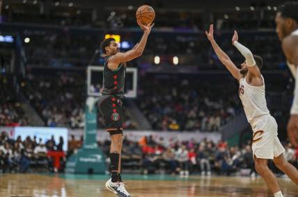Feb 25, 2024; Washington, District of Columbia, USA;  Washington Wizards guard Jordan Poole (13) shoots over Cleveland Cavaliers forward Georges Niang (20) during the second  half at Capital One Arena. Mandatory Credit: Tommy Gilligan-USA TODAY Sports