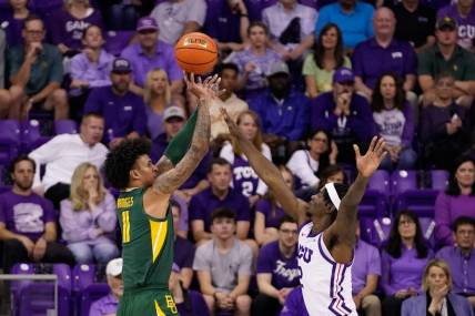 Feb 26, 2024; Fort Worth, Texas, USA; Baylor Bears forward Jalen Bridges (11) shoots over TCU Horned Frogs forward Emanuel Miller (2) during the first half at Ed and Rae Schollmaier Arena. Mandatory Credit: Raymond Carlin III-USA TODAY Sports