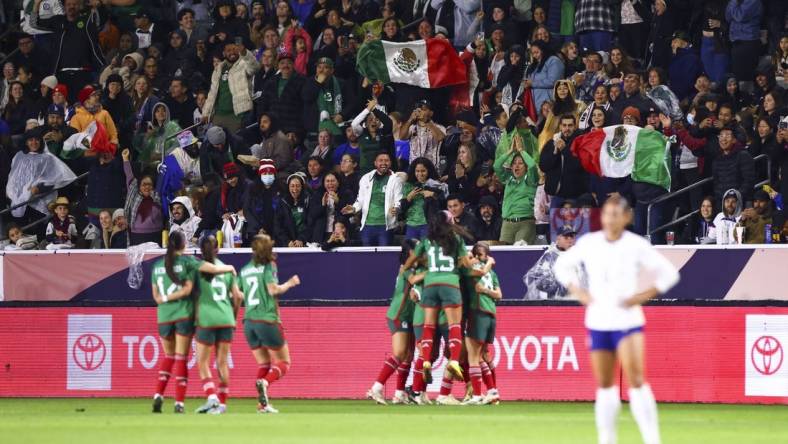 Feb 26, 2024; Carson, California, USA; Mexico midfielder Jacqueline Ovalle (11) celebrates with her teammates and fans cheer after Ovalle scores a goal during the first half of a game against the United States at Dignity Health Sports Park. Mandatory Credit: Jessica Alcheh-USA TODAY Sports