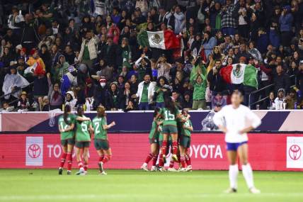 Feb 26, 2024; Carson, California, USA; Mexico midfielder Jacqueline Ovalle (11) celebrates with her teammates and fans cheer after Ovalle scores a goal during the first half of a game against the United States at Dignity Health Sports Park. Mandatory Credit: Jessica Alcheh-USA TODAY Sports