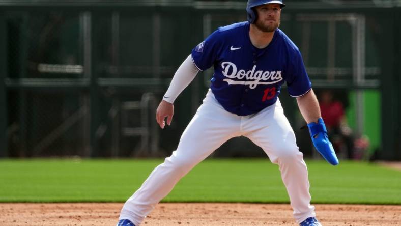 Feb 27, 2024; Phoenix, Arizona, USA; Los Angeles Dodgers third baseman Max Muncy (13) leads off first base during the first inning at Camelback Ranch-Glendale. Mandatory Credit: Joe Camporeale-USA TODAY Sports