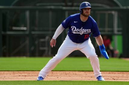Feb 27, 2024; Phoenix, Arizona, USA; Los Angeles Dodgers third baseman Max Muncy (13) leads off first base during the first inning at Camelback Ranch-Glendale. Mandatory Credit: Joe Camporeale-USA TODAY Sports