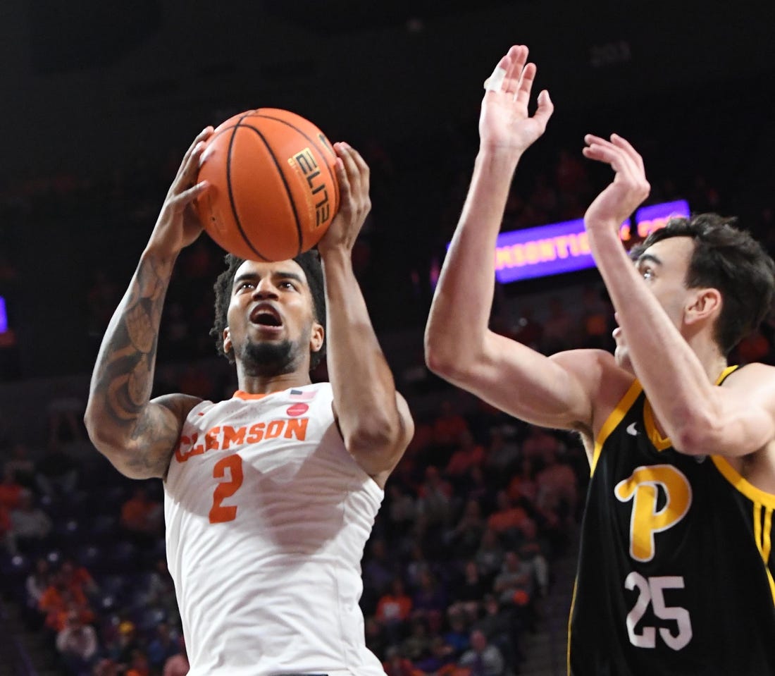 Feb 27, 2024; Clemson, South Carolina, USA;  Clemson sophomore guard Dillon Hunter (2) takes a shot near Pitt forward Guillermo Diaz Graham (25) during the first half at Littlejohn Coliseum. Mandatory Credit: Ken Ruinard-USA TODAY Sports