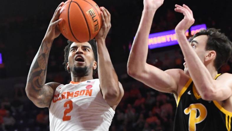 Feb 27, 2024; Clemson, South Carolina, USA;  Clemson sophomore guard Dillon Hunter (2) takes a shot near Pitt forward Guillermo Diaz Graham (25) during the first half at Littlejohn Coliseum. Mandatory Credit: Ken Ruinard-USA TODAY Sports