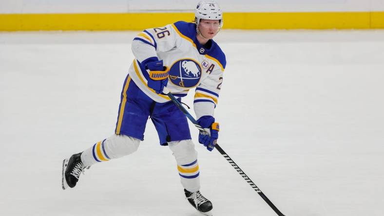 Feb 27, 2024; Sunrise, Florida, USA; Buffalo Sabres defenseman Rasmus Dahlin (26) moves the puck against the Florida Panthers during the first period at Amerant Bank Arena. Mandatory Credit: Sam Navarro-USA TODAY Sports