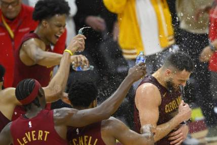 Feb 27, 2024; Cleveland, Ohio, USA; Cleveland Cavaliers guard Max Strus (1) is doused with water after hitting a last-second, game-winning three-point basket in the fourth quarter against the Dallas Mavericks at Rocket Mortgage FieldHouse. Mandatory Credit: David Richard-USA TODAY Sports