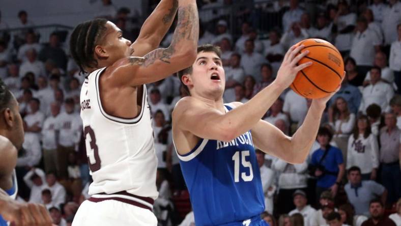 Feb 27, 2024; Starkville, Mississippi, USA; Kentucky Wildcats guard Reed Sheppard (15) drives to the basket as Mississippi State Bulldogs guard Shakeel Moore (3) defends during the second half at Humphrey Coliseum. Mandatory Credit: Petre Thomas-USA TODAY Sports