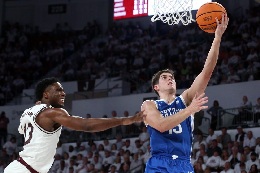 Feb 27, 2024; Starkville, Mississippi, USA; Kentucky Wildcats guard Reed Sheppard (15) drives to the basket as Mississippi State Bulldogs guard Josh Hubbard (13) defends during the second half at Humphrey Coliseum. Mandatory Credit: Petre Thomas-USA TODAY Sports