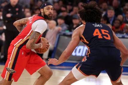 Feb 27, 2024; New York, New York, USA; New Orleans Pelicans forward Brandon Ingram (14) controls the ball against New York Knicks center Jericho Sims (45) during the third quarter at Madison Square Garden. Mandatory Credit: Brad Penner-USA TODAY Sports