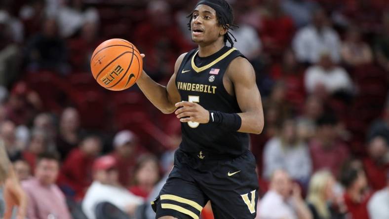 Feb 27, 2024; Fayetteville, Arkansas, USA; Vanderbilt Commodores guard Ezra Manjon (5) brings the ball up court during the first half against the Arkansas Razorbacks at Bud Walton Arena. Mandatory Credit: Nelson Chenault-USA TODAY Sports