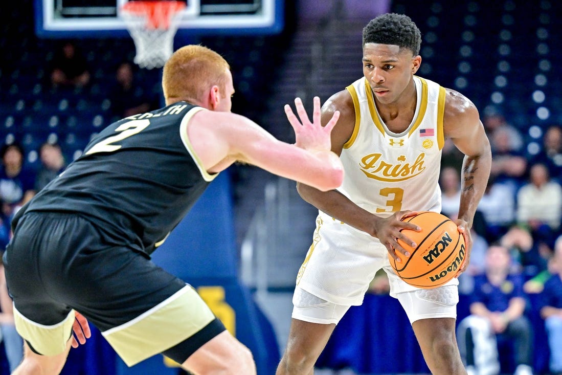 Feb 27, 2024; South Bend, Indiana, USA; Notre Dame Fighting Irish guard Markus Burton (3) holds the ball as Wake Forest Demon Deacons guard Cameron Hildreth (2) defends in the first half at the Purcell Pavilion. Mandatory Credit: Matt Cashore-USA TODAY Sports