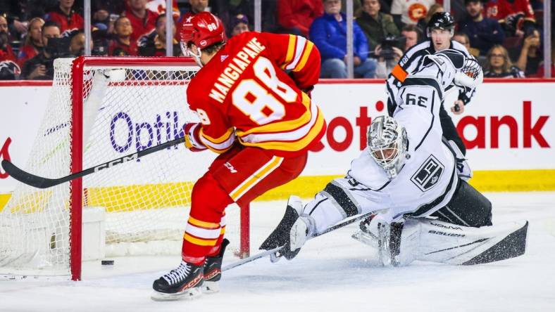 Feb 27, 2024; Calgary, Alberta, CAN; Calgary Flames left wing Andrew Mangiapane (88) scores a goal against Los Angeles Kings goaltender Cam Talbot (39) during the second period at Scotiabank Saddledome. Mandatory Credit: Sergei Belski-USA TODAY Sports