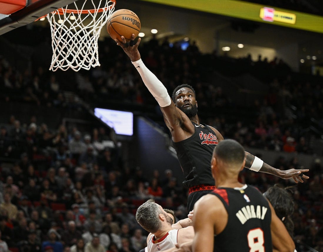 Feb 27, 2024; Portland, Oregon, USA; Portland Trail Blazers center Deandre Ayton (2) scores a basket during the first half against Miami Heat forward Kevin Love (42) at Moda Center. Mandatory Credit: Troy Wayrynen-USA TODAY Sports