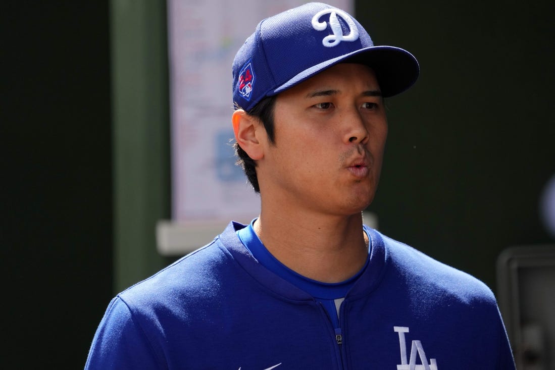 Feb 28, 2024; Surprise, Arizona, USA; Los Angeles Dodgers designated hitter Shohei Ohtani (17) looks on prior to the game against the Texas Rangers at Surprise Stadium. Mandatory Credit: Joe Camporeale-USA TODAY Sports