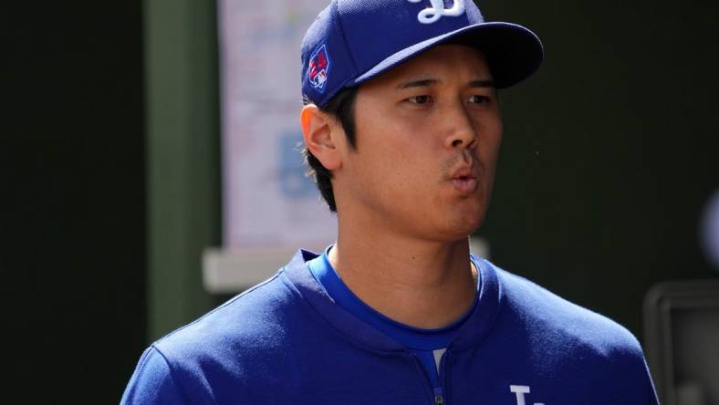 Feb 28, 2024; Surprise, Arizona, USA; Los Angeles Dodgers designated hitter Shohei Ohtani (17) looks on prior to the game against the Texas Rangers at Surprise Stadium. Mandatory Credit: Joe Camporeale-USA TODAY Sports