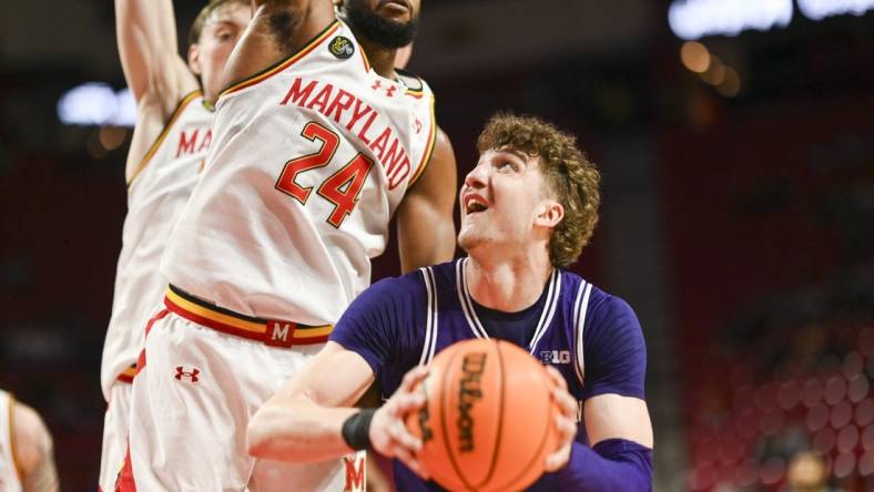 Feb 28, 2024; College Park, Maryland, USA; Northwestern Wildcats forward Nick Martinelli (2) looks to shoot as Maryland Terrapins forward Donta Scott (24) defends during the fist half at Xfinity Center. Mandatory Credit: Tommy Gilligan-USA TODAY Sports