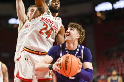 Feb 28, 2024; College Park, Maryland, USA; Northwestern Wildcats forward Nick Martinelli (2) looks to shoot as Maryland Terrapins forward Donta Scott (24) defends during the fist half at Xfinity Center. Mandatory Credit: Tommy Gilligan-USA TODAY Sports