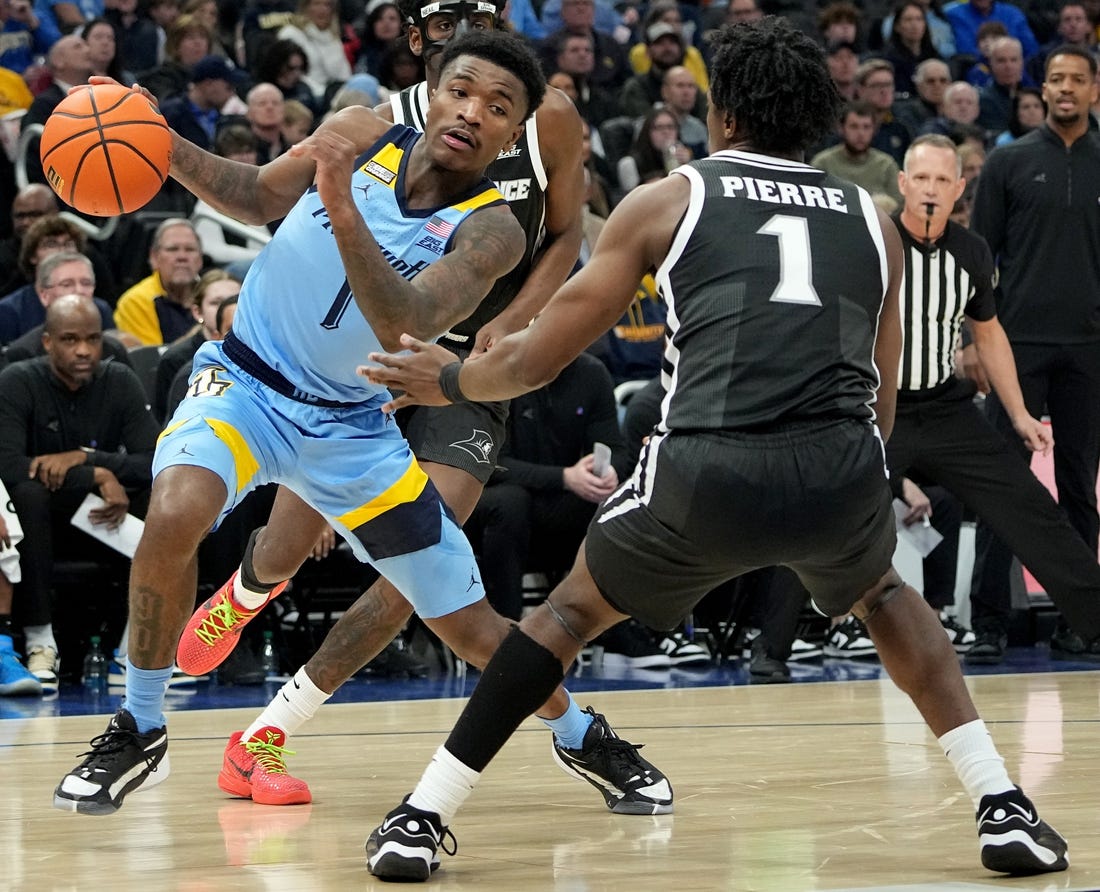 Feb 28, 2024; Milwaukee, Wisconsin, USA; Marquette guard Kam Jones (1) makes a move on Providence guard Jayden Pierre (1) during the first half of their game at Fiserv Forum. Mandatory Credit: Mark Hoffman/Milwaukee Journal Sentinel-USA TODAY Sports