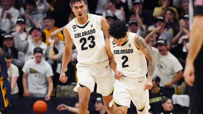 Feb 28, 2024; Boulder, Colorado, USA; Colorado Buffaloes forward Tristan da Silva (23) celebrates with guard KJ Simpson (2) in the first half against the California Golden Bears at the CU Events Center. Mandatory Credit: Ron Chenoy-USA TODAY Sports