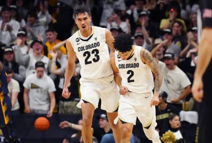 Feb 28, 2024; Boulder, Colorado, USA; Colorado Buffaloes forward Tristan da Silva (23) celebrates with guard KJ Simpson (2) in the first half against the California Golden Bears at the CU Events Center. Mandatory Credit: Ron Chenoy-USA TODAY Sports