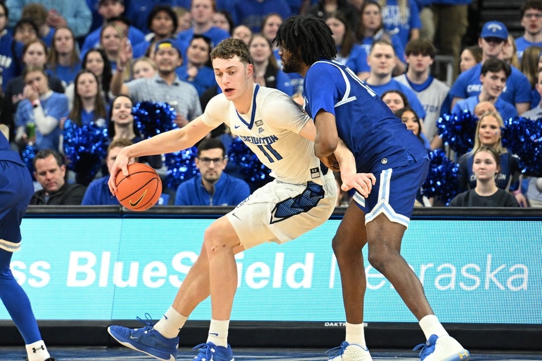 Feb 28, 2024; Omaha, Nebraska, USA; Creighton Bluejays center Ryan Kalkbrenner (11) drives against Seton Hall Pirates center Jaden Bediako (15) in the first half at CHI Health Center Omaha. Mandatory Credit: Steven Branscombe-USA TODAY Sports