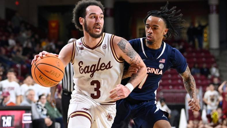 Feb 28, 2024; Chestnut Hill, Massachusetts, USA; Boston College Eagles guard Jaeden Zackery (3) drives the ball  against Virginia Cavaliers guard Dante Harris (1) during the second half at Conte Forum. Mandatory Credit: Eric Canha-USA TODAY Sports