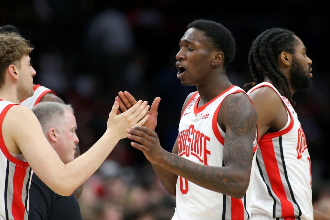 Feb 29, 2024; Columbus, Ohio, USA;  Ohio State Buckeyes guard Scotty Middleton (0) celebrates with teammates during the first half against the Nebraska Cornhuskers at Value City Arena. Mandatory Credit: Joseph Maiorana-USA TODAY Sports