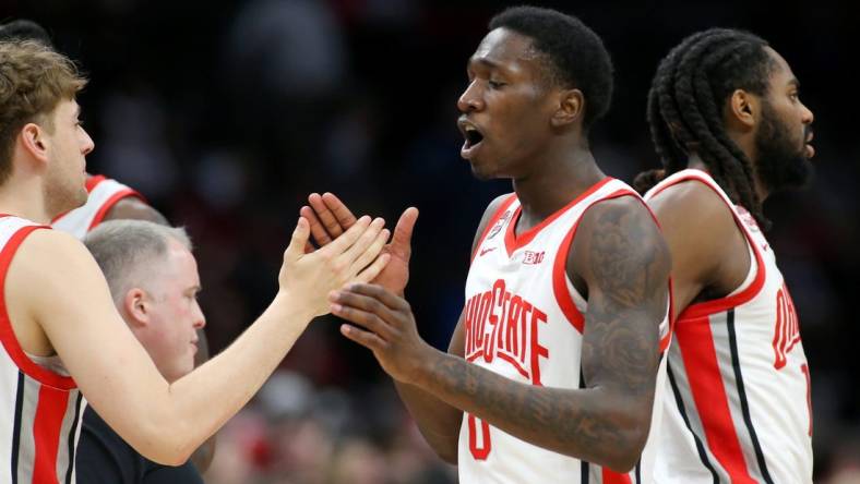 Feb 29, 2024; Columbus, Ohio, USA;  Ohio State Buckeyes guard Scotty Middleton (0) celebrates with teammates during the first half against the Nebraska Cornhuskers at Value City Arena. Mandatory Credit: Joseph Maiorana-USA TODAY Sports