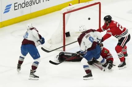 Feb 29, 2024; Chicago, Illinois, USA; Colorado Avalanche center Ross Colton (20) scores a goal on Chicago Blackhawks goaltender Petr Mrazek (34) during the second period at United Center. Mandatory Credit: David Banks-USA TODAY Sports