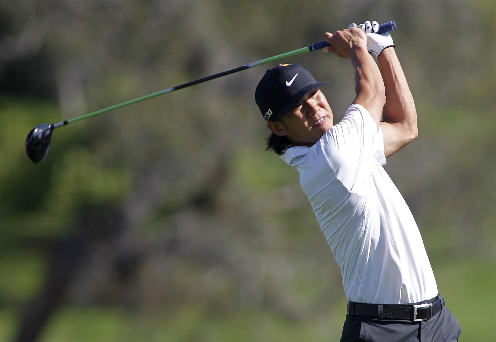 Anthony Kim of the U.S. watches his tee shot on the 16th hole during first round play in the Arnold Palmer Invitational PGA golf tournament in Orlando, Florida, March 22, 2012.