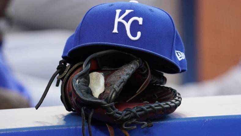 Jul 30, 2021; Toronto, Ontario, CAN; A Kansas City Royals hat and glove in the dugout during a game against the Toronto Blue Jays at Rogers Centre. Mandatory Credit: John E. Sokolowski-USA TODAY Sports