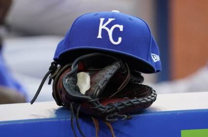 Jul 30, 2021; Toronto, Ontario, CAN; A Kansas City Royals hat and glove in the dugout during a game against the Toronto Blue Jays at Rogers Centre. Mandatory Credit: John E. Sokolowski-USA TODAY Sports