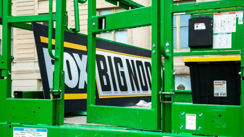 A Big Noon Kickoff logo is seen on a lift as setup continues for the Fox Sports NCAA football Big Noon Kickoff pregame show, Friday, Oct. 8, 2021, on the east side of the Pentacrest on the University of Iowa campus in Iowa City, Iowa.

211008 Big Noon Setup 007 Jpg