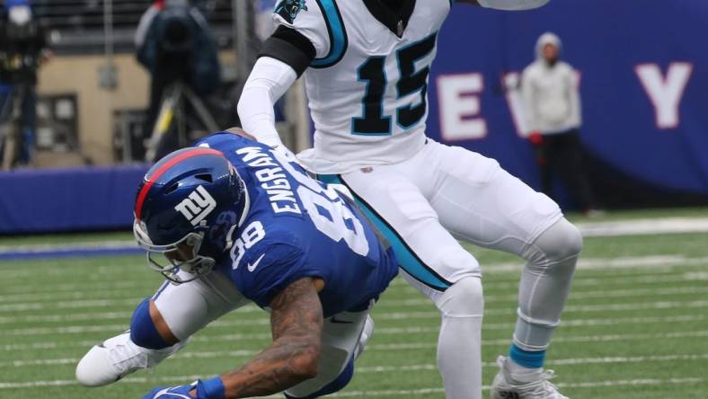 Evan Engram of the Giants is chased down and tackled by C.J. Henderson of Carolina in the first half as the Carolina Panthers faced the New York Giants at MetLife Stadium in East Rutherford, NJ on October 24, 2021.

The Carolina Panthers Faced The New York Giants At Metlife Stadium In East Rutherford Nj On October 24 2021