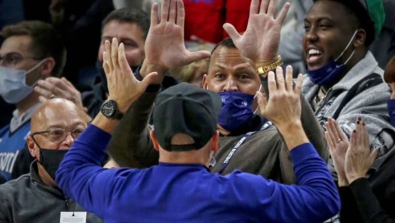 Oct 25, 2021; Minneapolis, Minnesota, USA; Minnesota Timberwolves minority owners Alex Rodriguez and Marc Lore cheer their team on in the third quarter against the New Orleans Pelicans at Target Center. Mandatory Credit: Bruce Kluckhohn-USA TODAY Sports