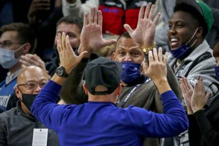 Oct 25, 2021; Minneapolis, Minnesota, USA; Minnesota Timberwolves minority owners Alex Rodriguez and Marc Lore cheer their team on in the third quarter against the New Orleans Pelicans at Target Center. Mandatory Credit: Bruce Kluckhohn-USA TODAY Sports