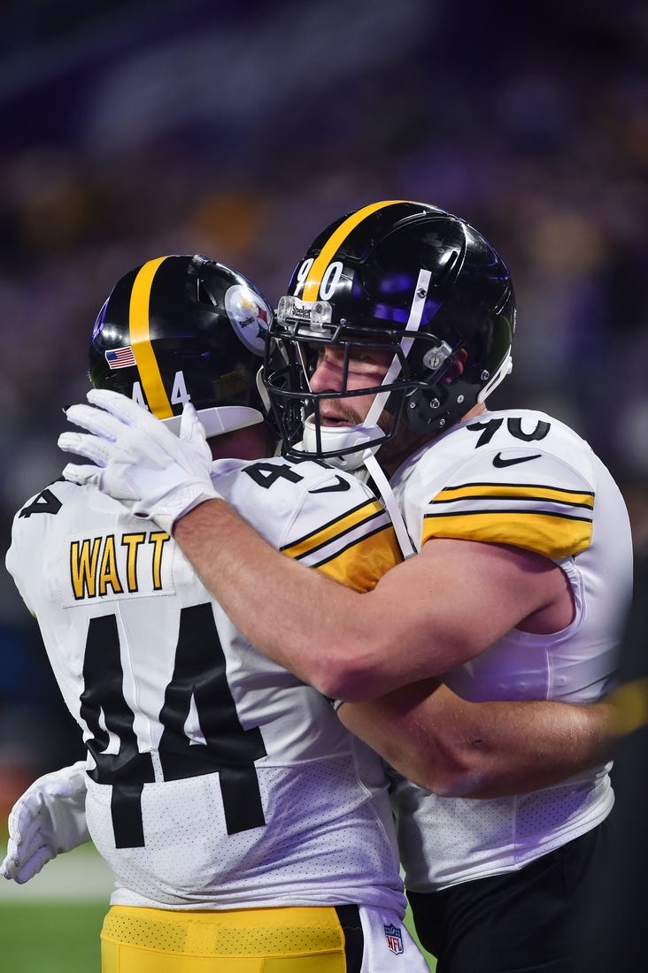 Dec 9, 2021; Minneapolis, Minnesota, USA; Pittsburgh Steelers outside linebacker T.J. Watt (right) and his brother fullback Derek Watt (44) embrace before the game against the Minnesota Vikings at U.S. Bank Stadium. Mandatory Credit: Jeffrey Becker-USA TODAY Sports