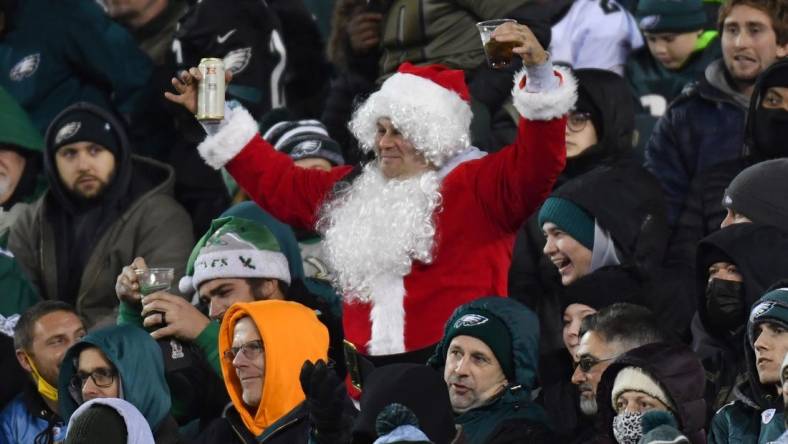 Dec 21, 2021; Philadelphia, Pennsylvania, USA; A Philadelphia Eagles fan dressed as Santa cheers during the fourth quarter against the Washington Football Team at Lincoln Financial Field. Mandatory Credit: Eric Hartline-USA TODAY Sports